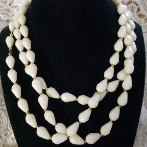 Off White Tear-drop shaped beads with Amber glass beads in between 52"